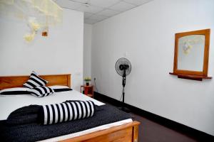 Кровать или кровати в номере Sunray Homestay