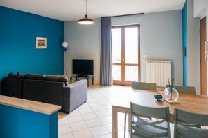 a living room with a couch and a table at ll Paiolo Magico in Montella