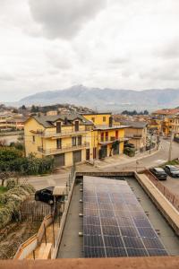 a group of buildings with solar panels on a street at ll Paiolo Magico in Montella