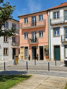 a building on a street in a city at Casa da Villa in Monção