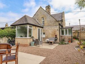 an extension to a house with a patio at The Lodge in Alnwick