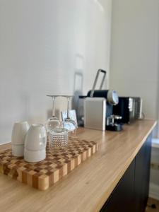 a wooden counter top with some items on it at Het Kantoor in Philippine +4 photos