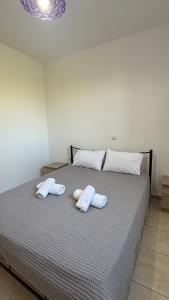 a bedroom with a bed with two towels on it at Apartment for Relaxed Holidays 3 in Kriezá
