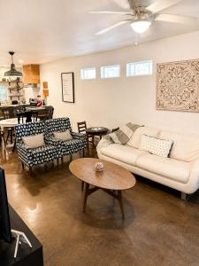 a living room with a couch and a table at Carriage House in Lufkin