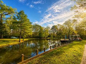 a river with a boat in the middle at Carriage House in Lufkin