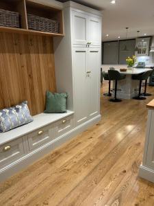 a living room with a bench and a table at Ladywell Barn in Threshfield