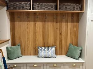 two pillows sitting on a shelf in a kitchen at Ladywell Barn in Threshfield