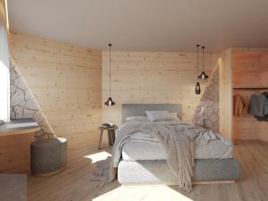 a bedroom with a bed and a wooden wall at al Ritrovo - rooms & more in Andalo