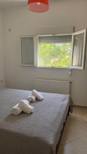 a bedroom with a bed with towels on it at Apartment for Relaxed Holidays 4 in Kriezá +11 photos