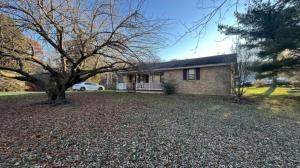 a house with a tree in front of it at Cozy Mountain Rancher in Harpers Ferry