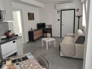 a living room with a couch and a table at La Casa di Mami in Velletri