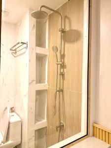 a shower with a glass door in a bathroom at Phi Phi Vista Nest Resort in Phi Phi Islands +10 photos