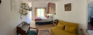 a living room with a bed and a couch at L'Intemporel in Saint-Cyr-sur-Mer +66 photos