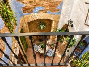 a view of a balcony with a table and chairs at La Rustiqueta Javea terraza BBQ casco antiguo in Jávea