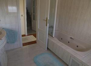 a bathroom with a tub and a shower and a sink at Casa Mar de Viladesuso in Oia +13 photos