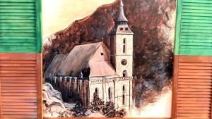 a painting of a church on the side of a building at Noemi Old Town in Braşov