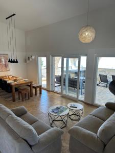 a living room with two couches and a table at Dalmata Lounge in Starigrad