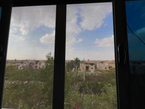 a view of a city from a window at Dora home in Cairo