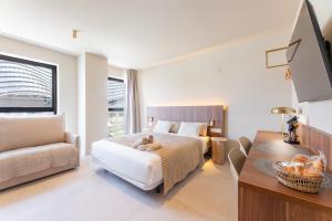 a bedroom with a bed with a teddy bear on it at A2B Collection Arena in Valencia