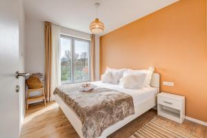 a bedroom with a bed and a window at Villa Ventula in Šuljkove Kuće +23 photos