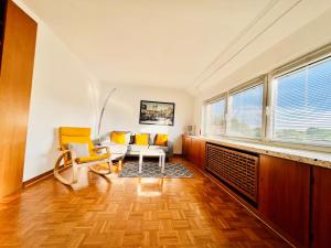 a living room with two chairs and a table at 3 sonnige Appartements in Soltau in Soltau