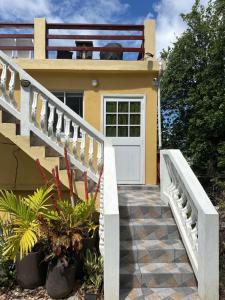 a house with a staircase leading to a door at Moulin A vent apartment in Monchy