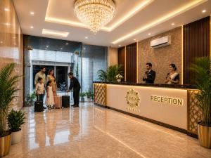 a group of people standing in the lobby of a hotel at Hotel Kian by JMD Group in New Delhi