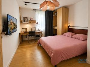 a hotel room with a bed and a desk and a bed at Les Rives Rémoises in Reims +61 photos