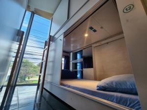 a room with two beds and a window at Mandala Yoga Hostel in Bogotá +27 photos