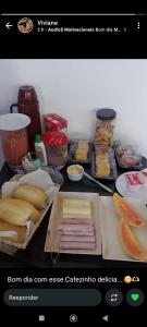 a page of a kitchen with food on a counter at Donwtonw in Arraial do Cabo