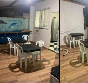 a table and chairs in a room with a table and a refrigerator at Donwtonw in Arraial do Cabo