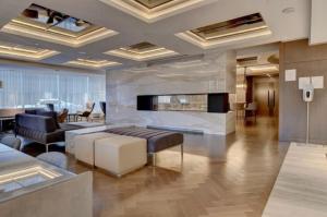 a living room with a couch and a fireplace at Luxury Apartments with View & Indoor Heated Pool in Montreal
