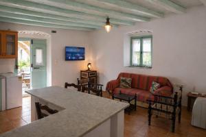 a living room with a couch and a table at Incavo in Potamós