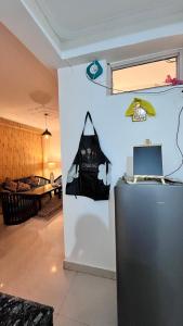 a room with a black bag on a wall at Premium 2BHK near Kainchi Dham in Bhowāli