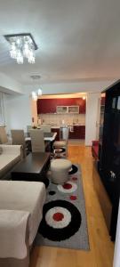 a living room with a couch and a table at Lina Apartment in Bitola