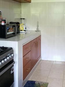 a kitchen with a stove and a counter top at Classy bedroom Ngong in Ngong