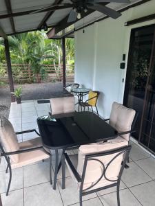 a dining table and chairs on a patio at Rustic Ranch in Fortuna