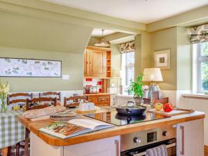 a kitchen with a island with a counter top at 4 Bed in Huntly oc-88855 in Inverurie