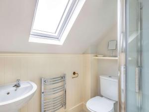 a bathroom with a sink toilet and a skylight at 4 Bed in Huntly oc-88855 in Inverurie +24 photos