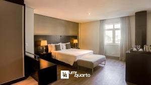 a hotel room with a bed and a window at Manhattan Floor in Curitiba +135 photos