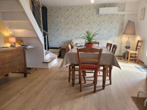 a dining room with a table and chairs at Charmes à Changey in Changey