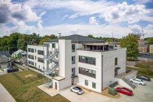 an aerial view of a white building with a parking lot at Southern Blue in McMinnville