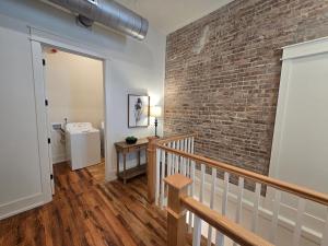 a room with a brick wall and a stairway at Southern Blue in McMinnville +153 photos