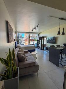 a living room with a couch and a table at Foster Studio - Park in Buenos Aires