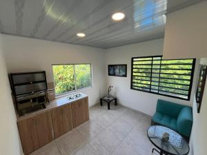a living room with a television and a couch and a table at 301ElBunkerSuiteRomance in Arauca