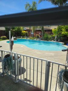 a swimming pool in a yard with a fence at Gateway to Napa in Fairfield