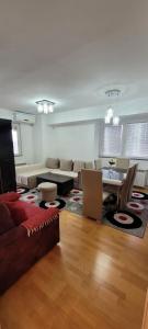 a living room with a couch and a table at Lina Apartment in Bitola