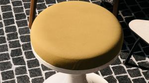 a yellow chair sitting on top of a floor at Ruby Luna Hotel Dusseldorf by IHG in Düsseldorf