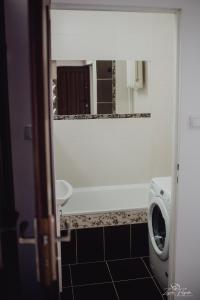 a bathroom with a urinal and a mirror at Mazurska przystań in Ryn
