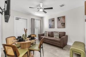 a living room with a couch and a table at Bayview Apartments By Lowkl in Fort Lauderdale